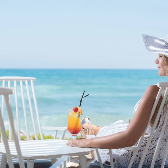 Cactus Bay visitor enjoying a cocktail